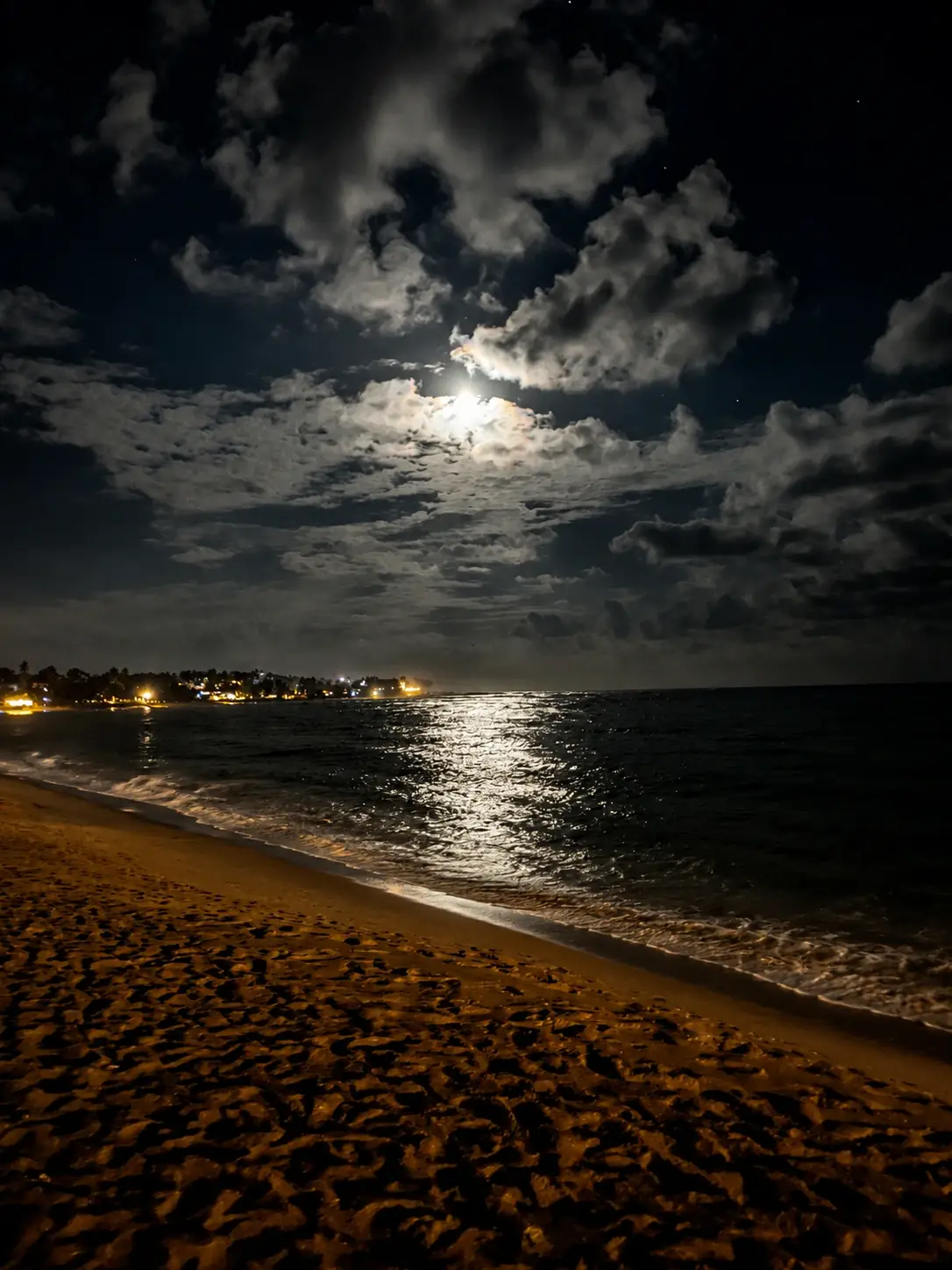 Moonlit Unawatuna beach at night near Kamayan Beach Restaurant